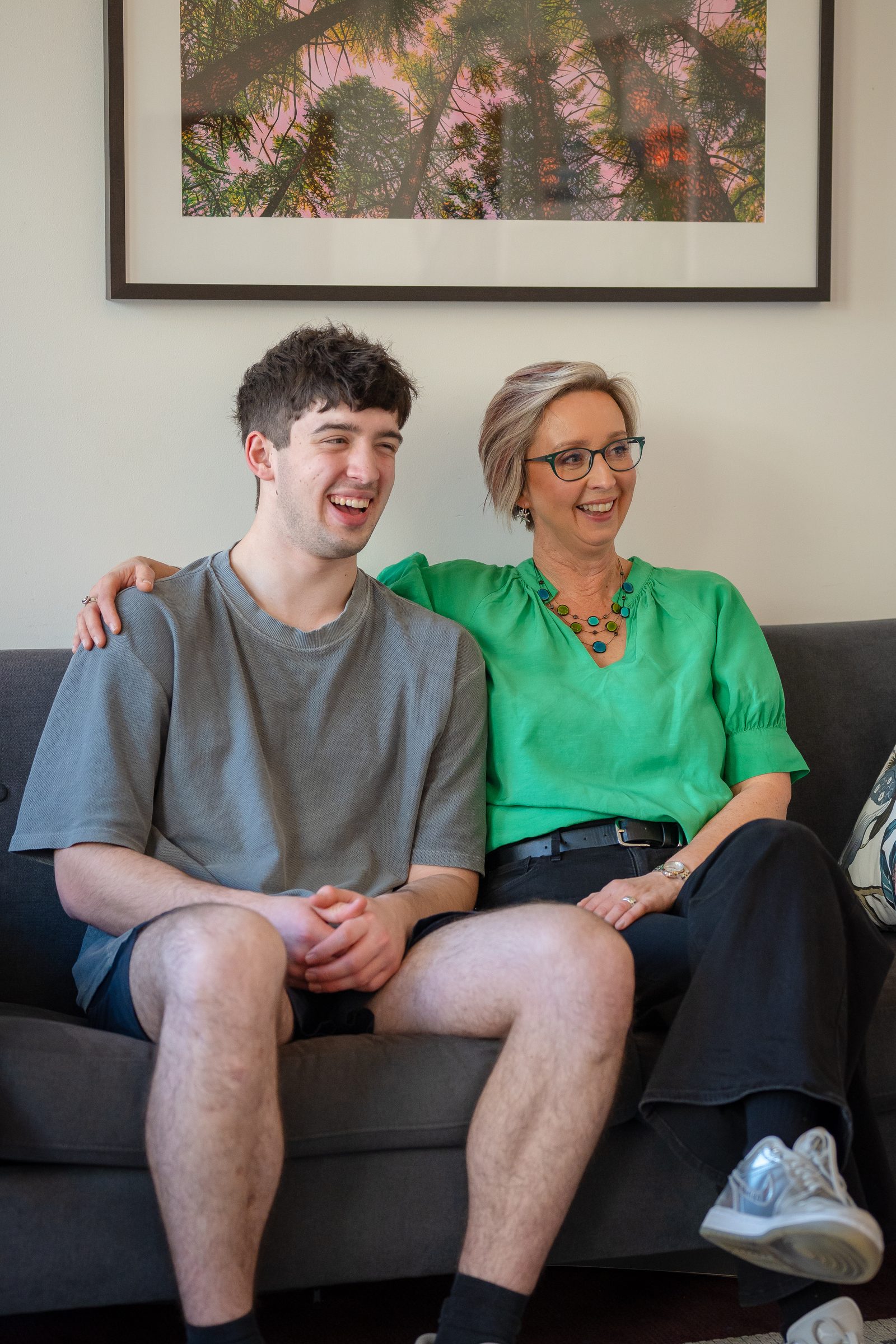 nicola-brown-laughing-with-son-on-couch-otepoti-dunedin